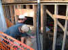 Working on bathroom window opening from exterior.JPG (54649 bytes)